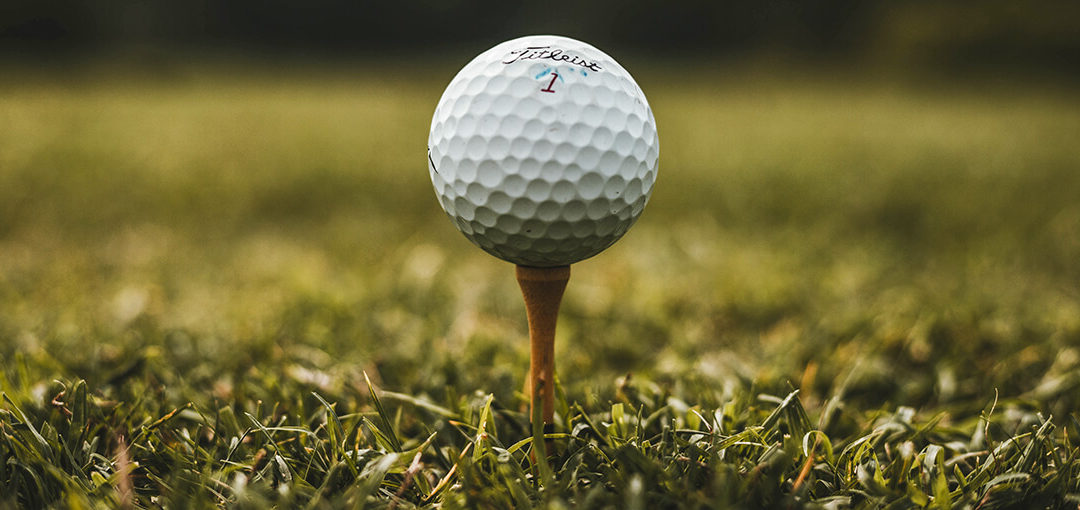 Titleist Golf Ball on a Wooden Tee Peg